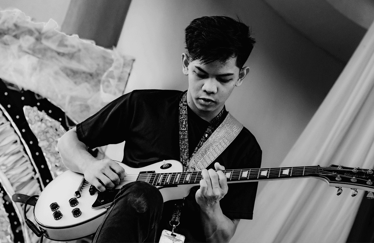 Dan playing the guitar.